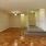 a room with a wood floor and white doors