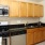 a kitchen with wooden cabinets