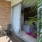 a patio with chairs and a table